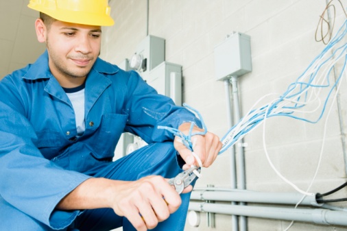 Electrician cutting wire